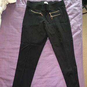 Leggings with gold zippers